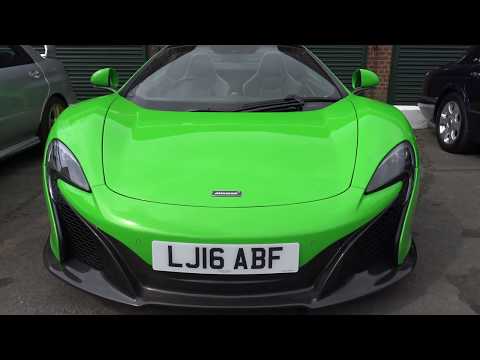 Supercars and classic cars leaving car show